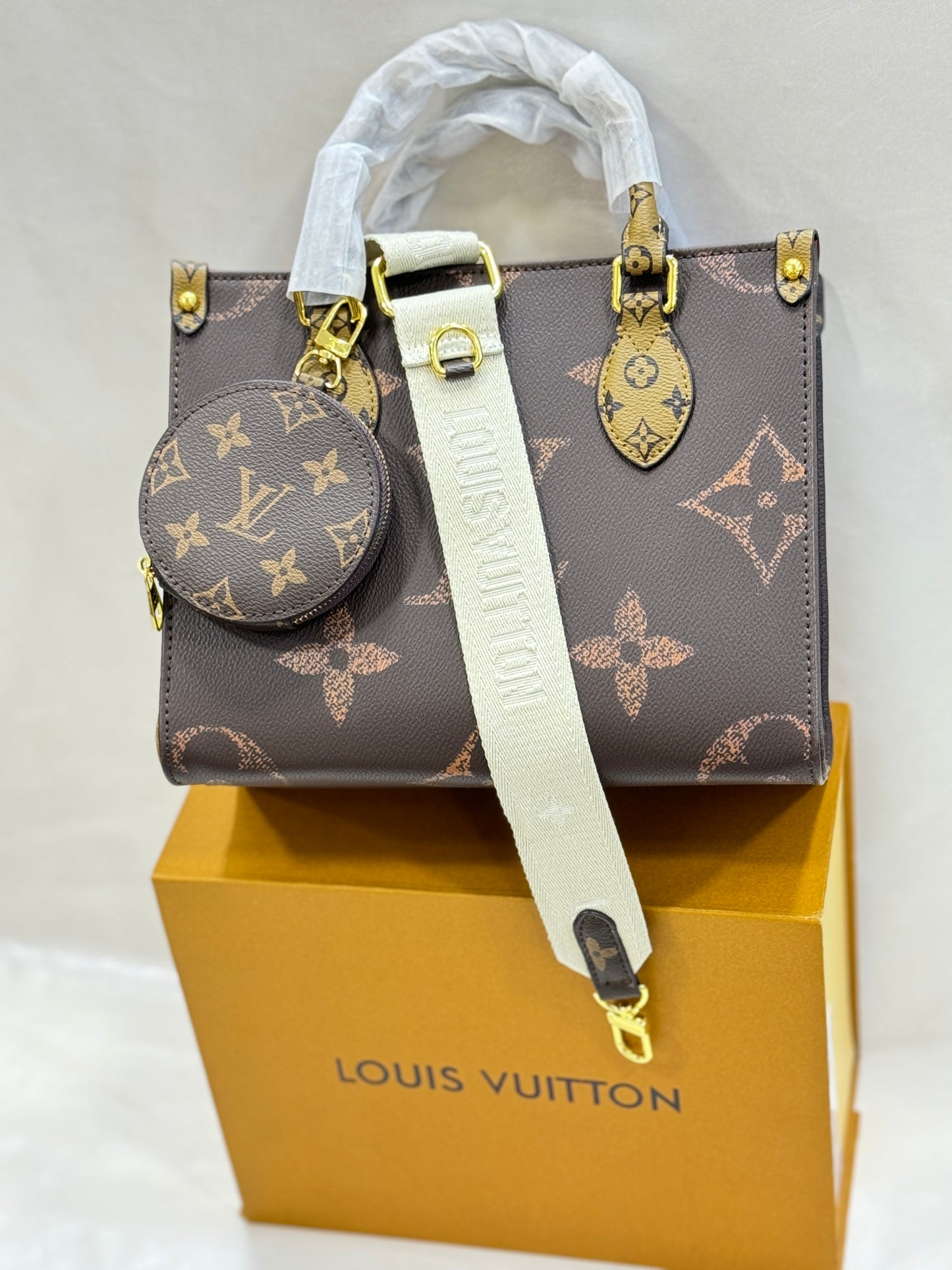 LOUIS VUITTON ON THE GO APRICOT BROWN HAND BAG ( WITH BOX )
